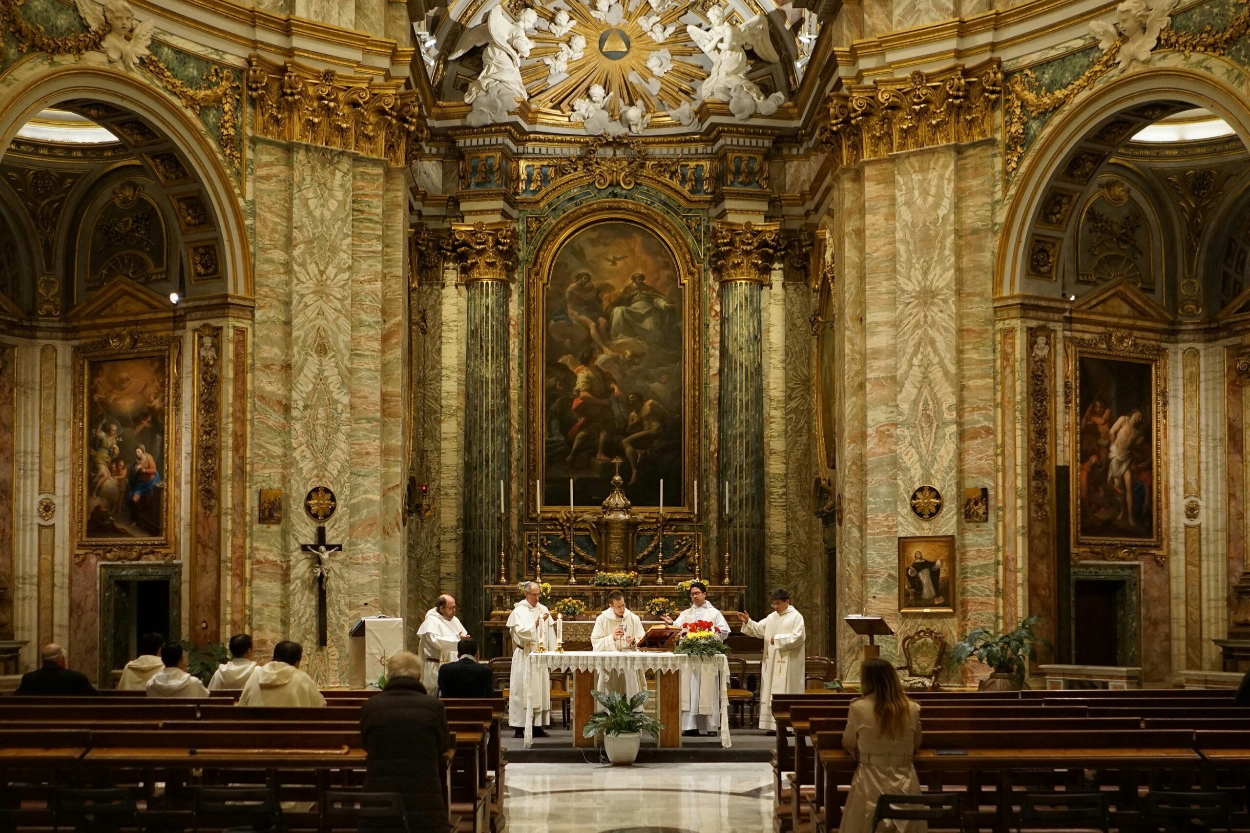 Catholics celebrating the Holy Sacrifice of the Mass